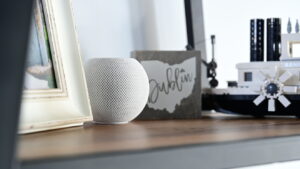 Apple HomePod Mini smart speaker on shelf